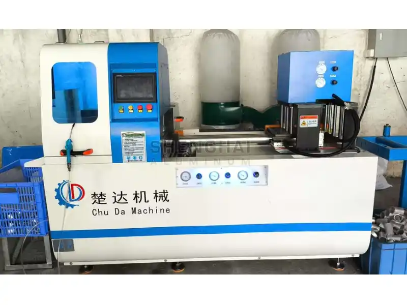 Specialized CNC Metal Cutter Compact specialized CNC metal cutting machine by Chu Da Machine (楚达机械) brand, showing its blue control panel and workpiece, in a workshop setting.